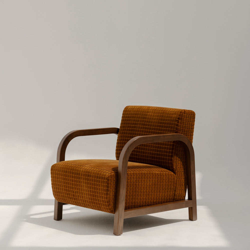 Lulu Armchair in premium fabric with modern design, perfect for stylish living room seating.