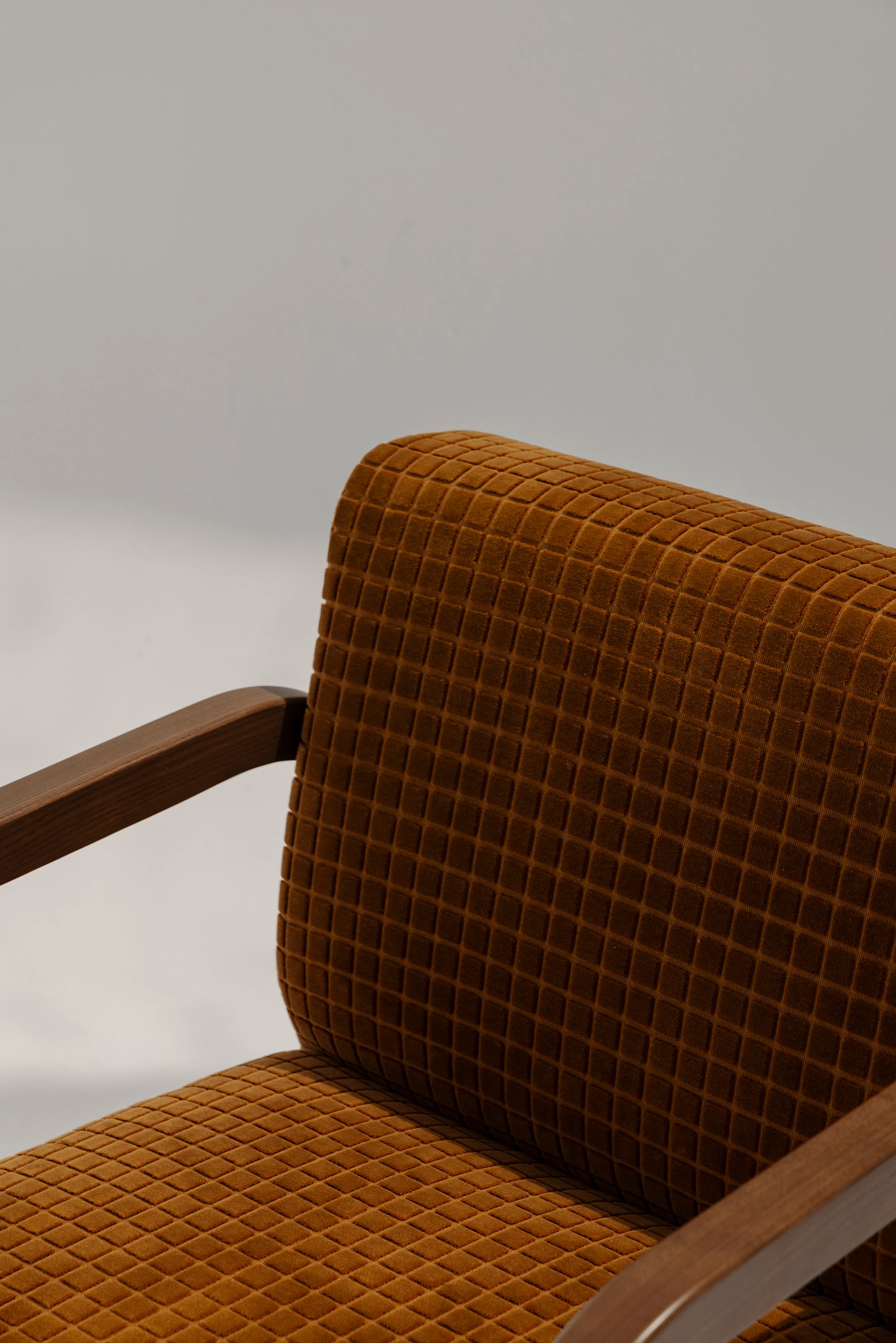 Lulu Armchair in premium fabric with modern design, perfect for stylish living room seating.